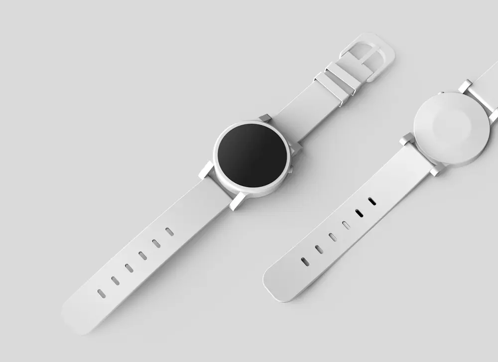 Dos relojes blancos de diseño minimalista sobre fondo gris claro